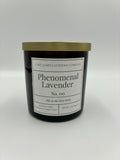 Black candle with gold lid and white label on a white background