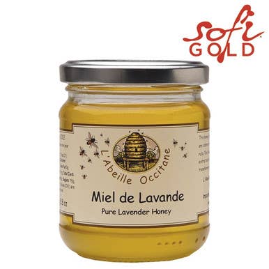 Jar of Miel de Lavande honey with Abeille Occitane branding on a white background