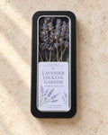 Lavender Cocktail Garnish window tin containing 30 culinary lavender sprigs, with Lake James Lavender Company label.